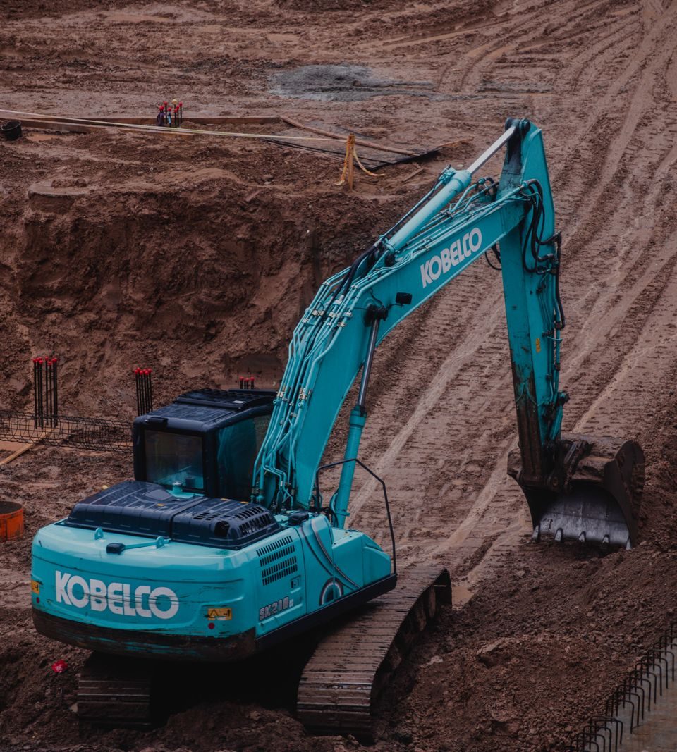 Excavator digging on a commercial job site