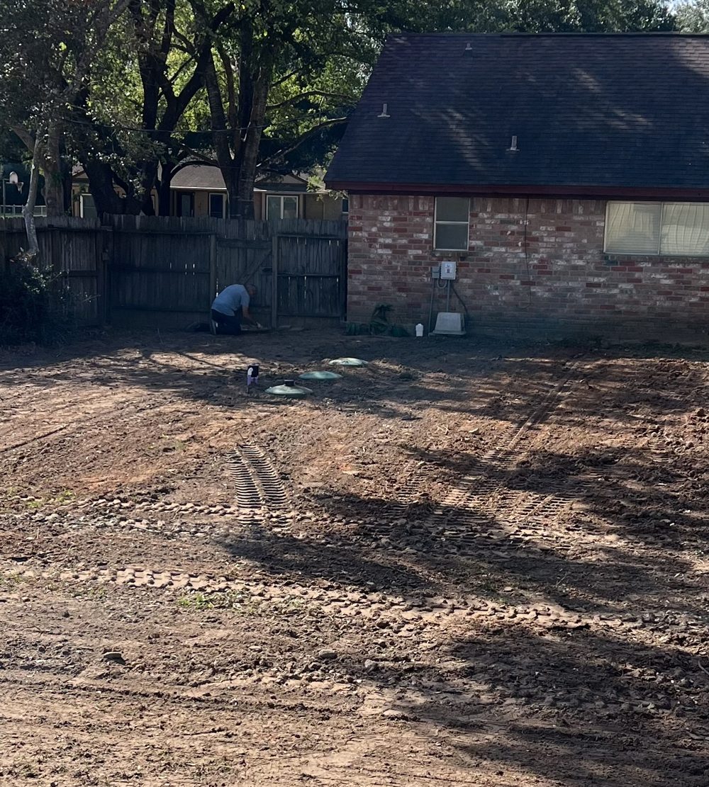Graded yard after septic system work, ready for grass