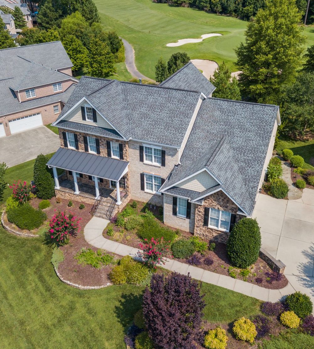 Aerial view of homes with large lawns